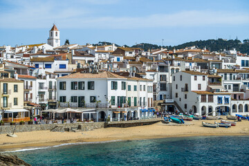 A classic white town on the Costa Brava. White houses, historical buildings of Calella de Palafrugell. Rocks, beach and sea view