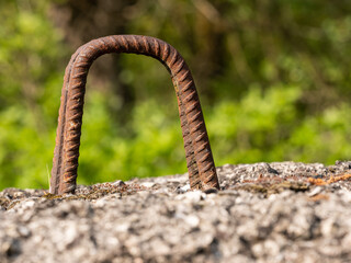 Lifting hook inserted into a reinforced concrete block