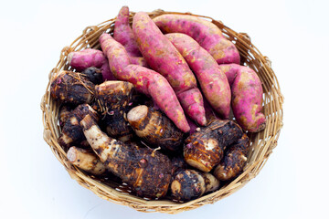 Sweet potato with taro in bamboo basket on white background.