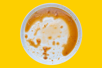 Dirty dish on yellow background. Top view