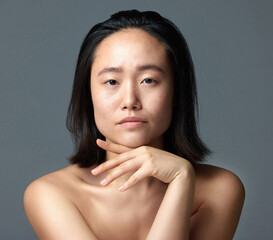 We want good skin even without the make-up. Studio shot of a beautiful young woman posing against a...