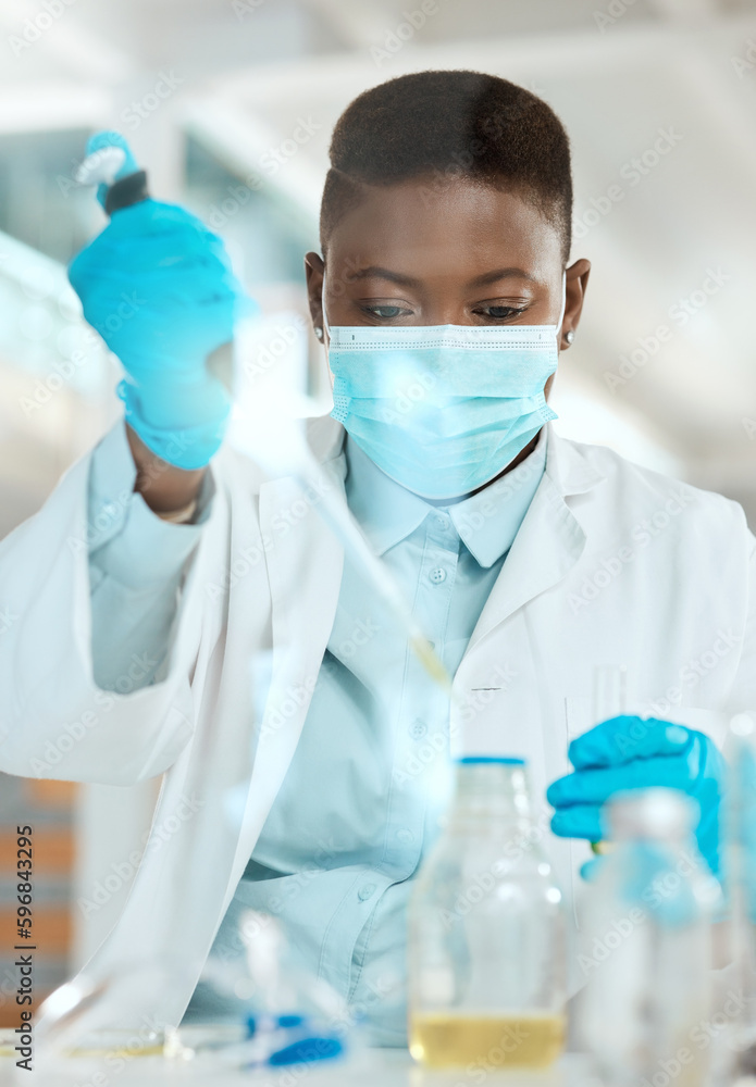 Poster getting down to the root of the problem. shot of a young scientist sitting alone in her laboratory a