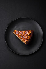 Delicious fresh cheesecake cake or snickers with cream and nuts