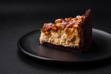 Delicious fresh cheesecake cake or snickers with cream and nuts