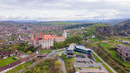 Aerial view of the Huniyad castle in Hunedoara, Romania in spring season, on a rainy day....
