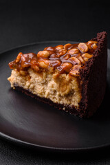 Delicious fresh cheesecake cake or snickers with cream and nuts
