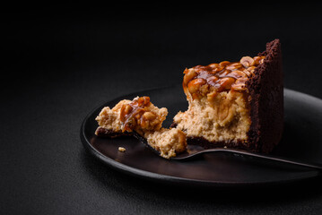 Delicious fresh cheesecake cake or snickers with cream and nuts - obrazy, fototapety, plakaty
