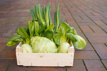 Wooden container with fresh vegetables. Organic food.