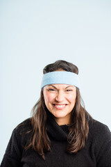 Blues my favourite colour. Shot of an attractive mature woman standing alone in the studio and posing while wearing a headband.