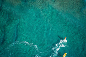 Wind surfer Kauai Napali Coast aerial view from Helicopter tour, golden hour