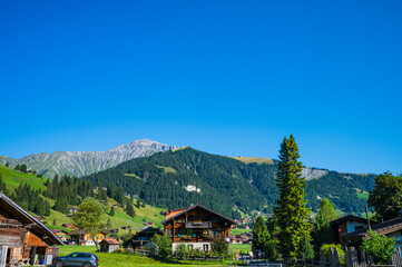 Fototapeta na wymiar Adelboden, Switzerland - July 24, 2022 - Summer view of Adelboden village and city center