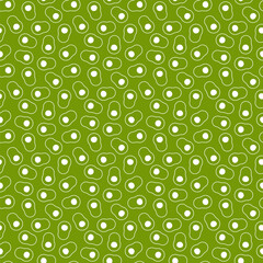 Seamless pattern of cute cut avocados on a green background