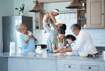 The kitchen is our favourite place to be. Shot of a multigenerational family baking together in the kitchen.