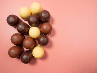 Chocolate covered marshmallow on a pink background. Close-Up.