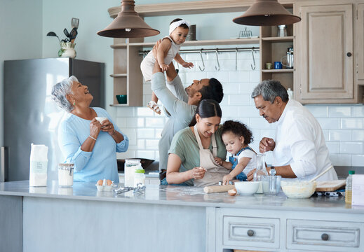 The kitchen is our happy place. Shot of a multigenerational family baking together in the kitchen.