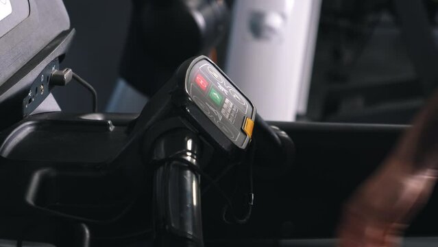 Treadmill panel, Running close-up, Gym workout. Person is running in gym, close-up treadmill control panel.