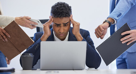 Give me a break for once. Shot of a young businessman looking stressed out in a demanding office environment.