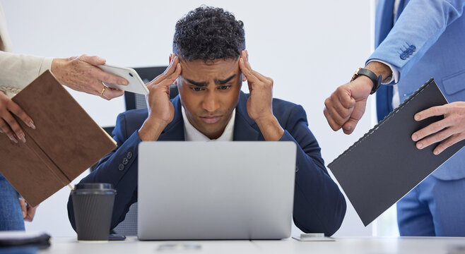 Give me a break for once. Shot of a young businessman looking stressed out in a demanding office environment.