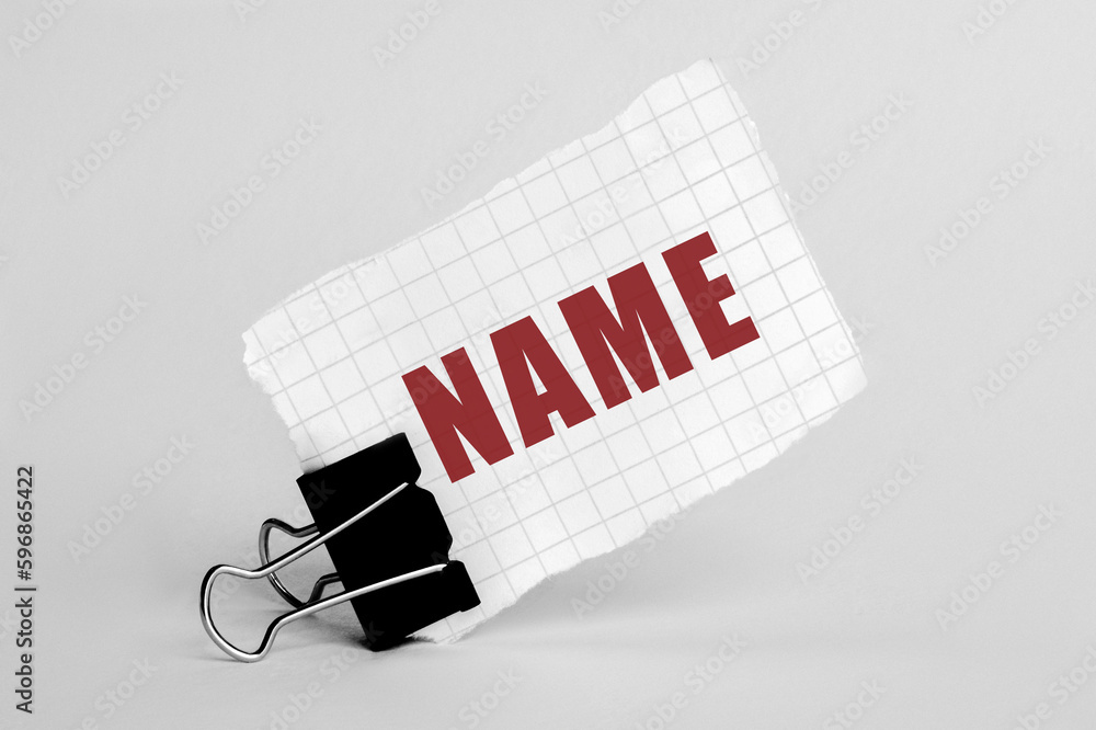 Poster piece of paper on a grey background with text name
