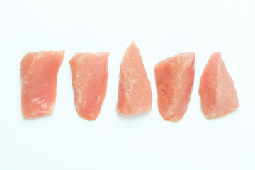 Raw chicken.Frozen chicken fillet..Ogranic food and healthy eating.frozen turkey or poultry meat.Fresh frozen pieces of turkey meat on a white background.