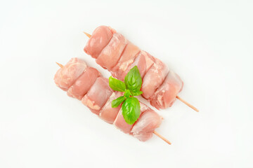 Chicken skewers.Food for retail.Skewers from raw chicken leg meat without skin for a supermarket on...