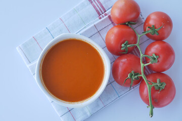 top view of tomato soup in a bowl on table .