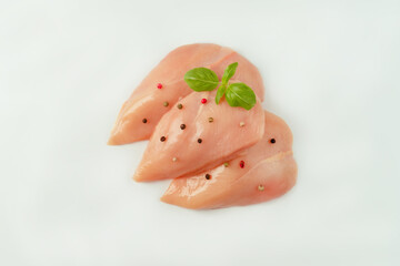 Chicken breast Fillets.Close up.Raw chicken meat.Raw fresh chicken fillet light background with...