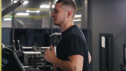 Gym Activities, Athletic Gym, Treadmill Running. Young sports enthusiast exercises at gym by running on treadmill.