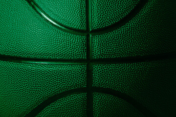 Closeup detail of green basketball ball texture background. Horizontal sport theme poster, greeting cards, headers, website and app