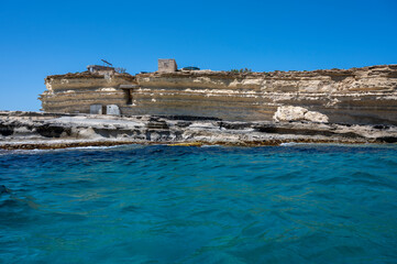 Rocky coastline of Marsaxlokk, Malta island