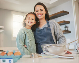 You can sign us up for a mother and daughter baking competition. Shot of a mom baking with her...