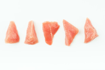 Fresh frozen pieces of turkey meat on a white background.Raw chicken.Frozen chicken fillet.Ogranic food and healthy eating.frozen turkey or poultry meat.Chicken Skewers breast fillet meat