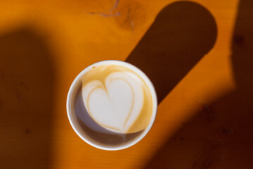 coffee cup latte art in the sunshine