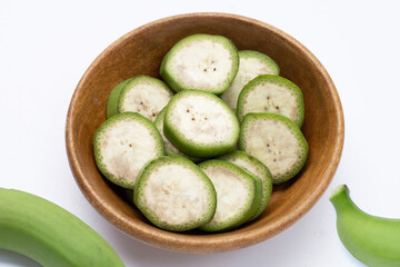 Raw banana slices on white background.