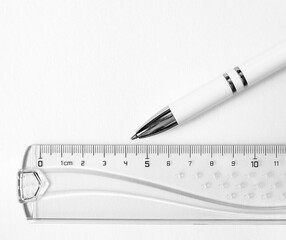 Office supplies paper, pen, pencil, ruler. Blank paper for notes, monochrome. Background with empty space for your text.