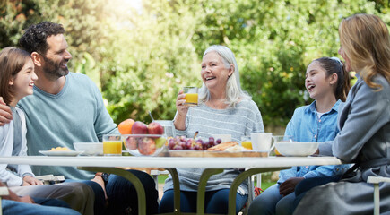 Family love is never broken. Shot of a family having lunch outside.