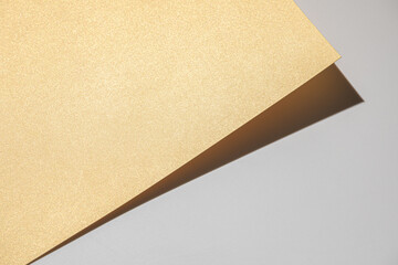 Golden cardbord on light gray background