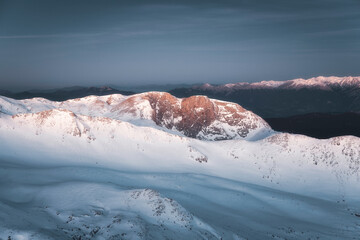 The first light of day on the snowy Mt. Parnassus