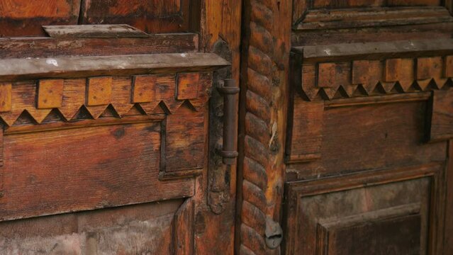 Antique wooden doors carved wood elements. Stock footage. Beautiful wooden doors.