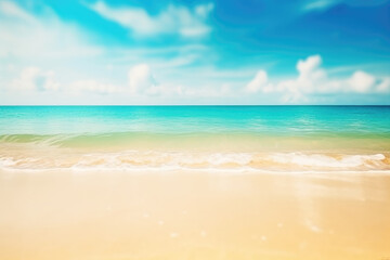 Obraz premium Abstract blur defocused background. Tropical summer beach with golden sand, turquoise ocean and blue sky with white clouds on bright sunny day. Colorful landscape for summer holidays
