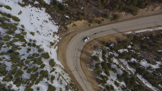 Top down view of a car as it navigates a Colorado switchback