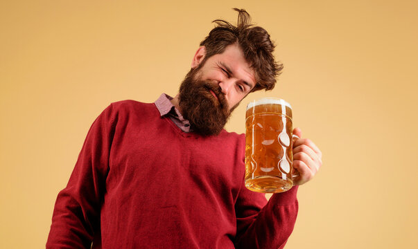 Celebration oktoberfest festival. Drunk man with craft beer mug. Man drinking beer. Germany traditions. Bearded hipster with glass of delicious beer. Pub and bar. Brewery concept. Alcohol and leisure.