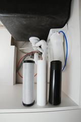 House water filtration system to drinkable condition, reverse osmosis. Filter cartridges of foamed...