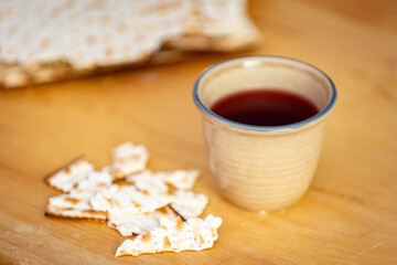 Cup of juice with broken matzah crackers