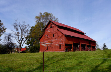 Fototapeta na wymiar Huge Red Wooden Barn and Home