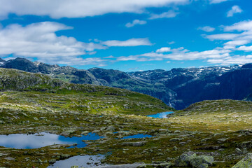 Beautiful blue ponds in the hiking trail of Trolltunga, Odda,  Norway