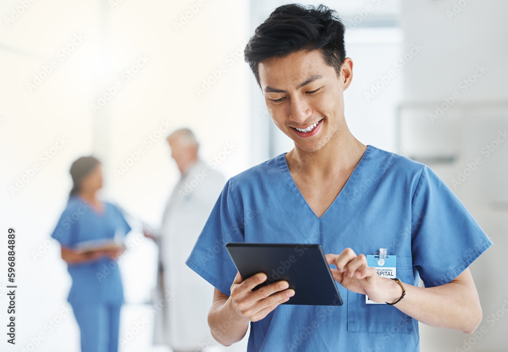 Poster getting loads more done in digital format. shot of a young doctor using a digital tablet in a hospit