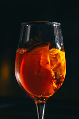 cocktail on a dark background with ice and fruits. menu format
