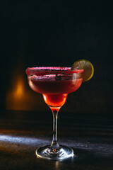 cocktail on a dark background with ice and fruits. menu format

