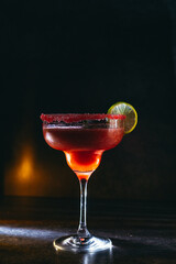 cocktail on a dark background with ice and fruits. menu format
